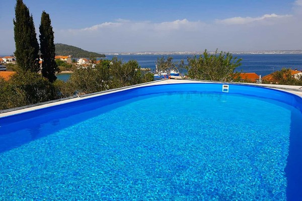 Stunning Apartment on island Ugljan with a sea sight balcony and a pool yard 