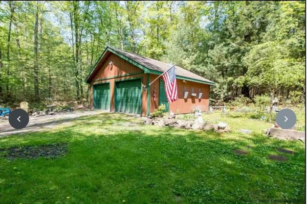A modern "State of the Art" Log Cabin  nestled in a serene wooded property.