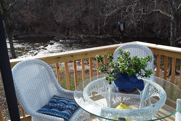 Mountains surround the Loft on the Doe River, overlooking rapids and wildlife.